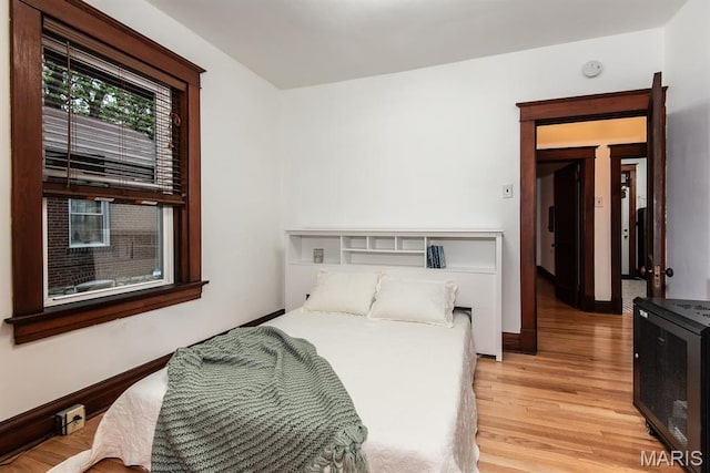 bedroom with light wood finished floors