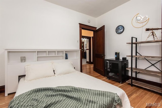 bedroom with light wood-style floors
