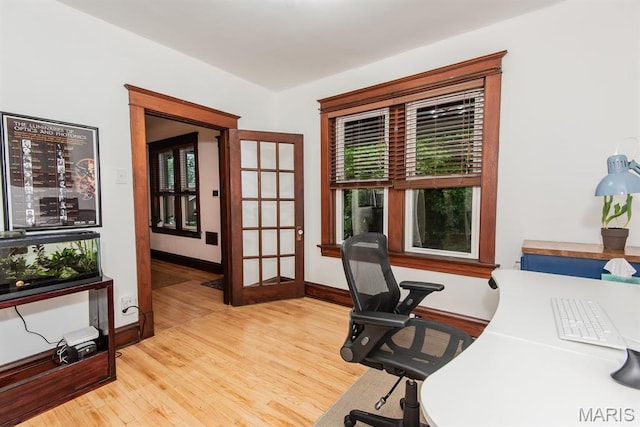 office space featuring wood finished floors and baseboards