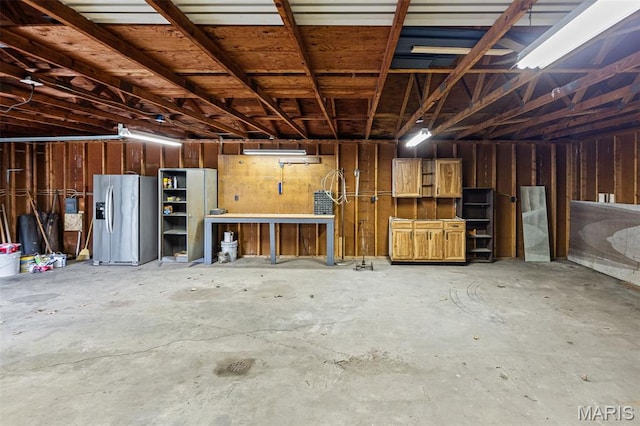 garage featuring stainless steel fridge