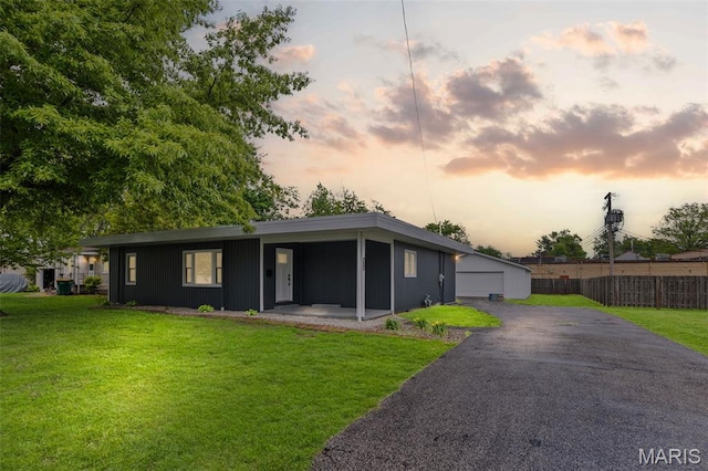 view of front of home featuring a garage and an outdoor structure