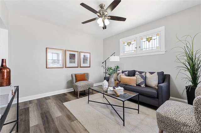4020 Neosho St, Saint Louis, MO 63116 - living area with wood finished floors, a ceiling fan, and baseboards