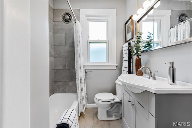 4020 Neosho St, Saint Louis, MO 63116 - bathroom featuring toilet, vanity, baseboards, shower / bath combo, and tile patterned floors