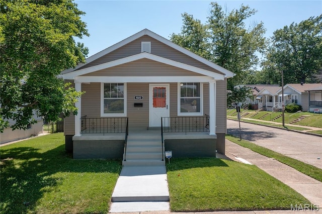 4020 Neosho St, Saint Louis, MO 63116 - view of front of property featuring a front yard and covered porch