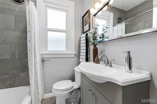 4020 Neosho St, Saint Louis, MO 63116 - full bathroom with plenty of natural light, toilet, shower / bath combo with shower curtain, and vanity