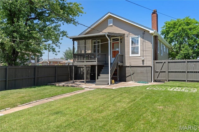 4020 Neosho St, Saint Louis, MO 63116 - rear view of property with a chimney and stairs