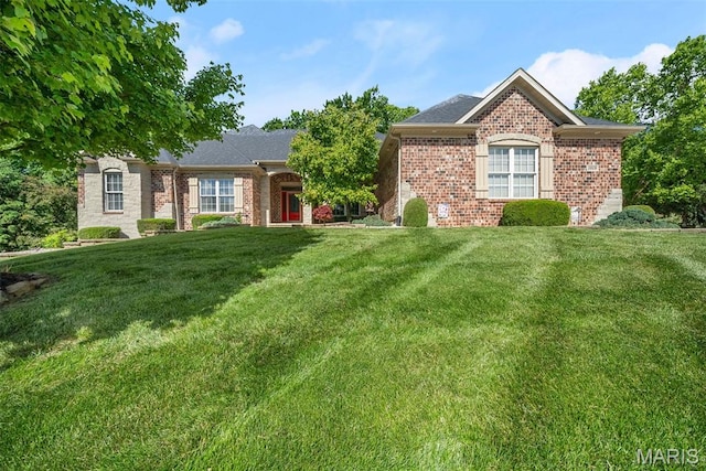 1019 Hawks Landing Dr, Lake St Louis, MO 63367 - view of front facade with brick siding and a front lawn