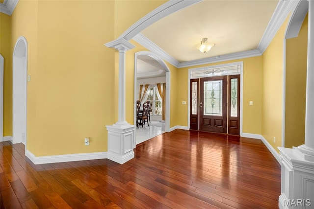 1019 Hawks Landing Dr, Lake St Louis, MO 63367 - foyer featuring arched walkways, hardwood / wood-style flooring, ornate columns, crown molding, and baseboards