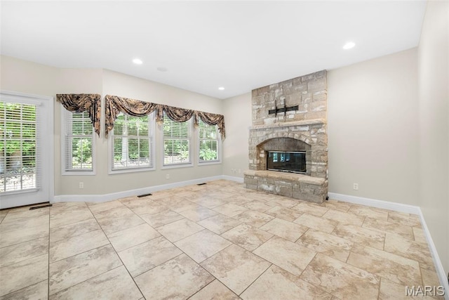 1019 Hawks Landing Dr, Lake St Louis, MO 63367 - unfurnished living room featuring baseboards, a fireplace, and recessed lighting