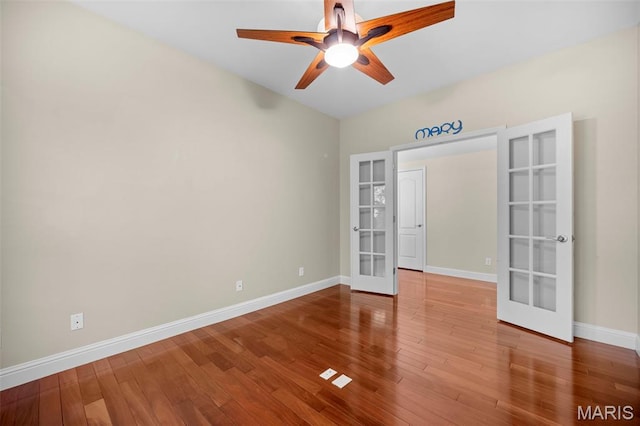 1019 Hawks Landing Dr, Lake St Louis, MO 63367 - spare room with french doors, a ceiling fan, baseboards, and wood finished floors