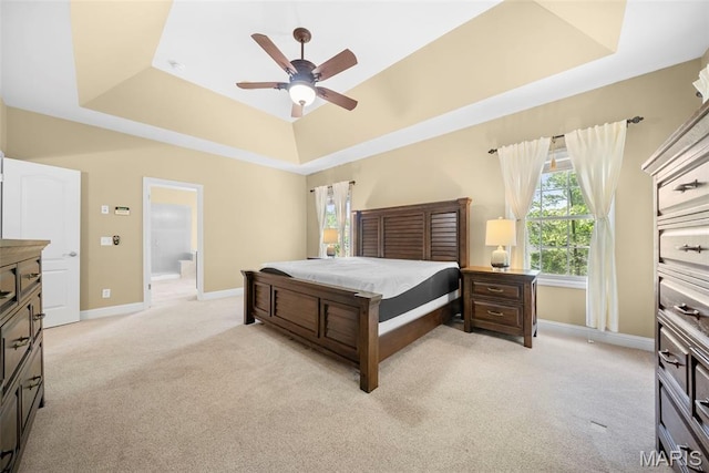 1019 Hawks Landing Dr, Lake St Louis, MO 63367 - bedroom with a tray ceiling, light carpet, multiple windows, and baseboards