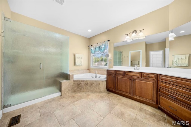 1019 Hawks Landing Dr, Lake St Louis, MO 63367 - full bath featuring a garden tub, vanity, and a stall shower