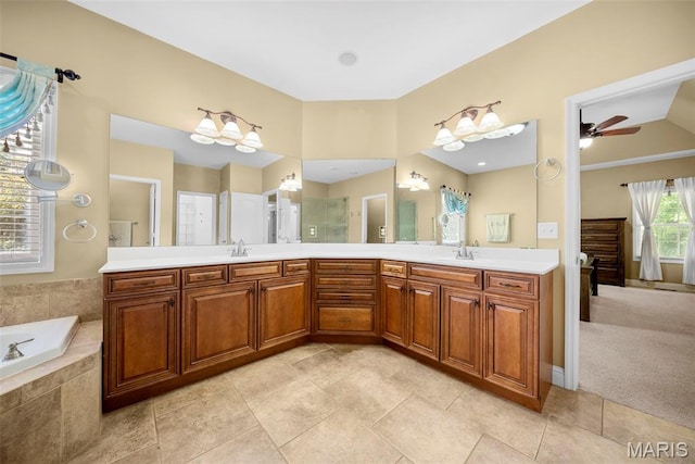 1019 Hawks Landing Dr, Lake St Louis, MO 63367 - ensuite bathroom featuring double vanity, a bath, a ceiling fan, a shower, and tile patterned flooring