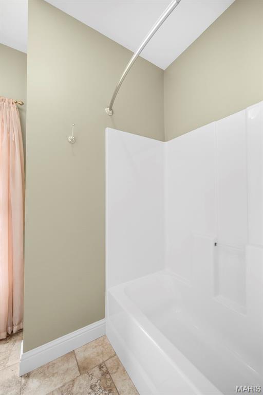 1019 Hawks Landing Dr, Lake St Louis, MO 63367 - full bathroom with baseboards and shower / tub combination
