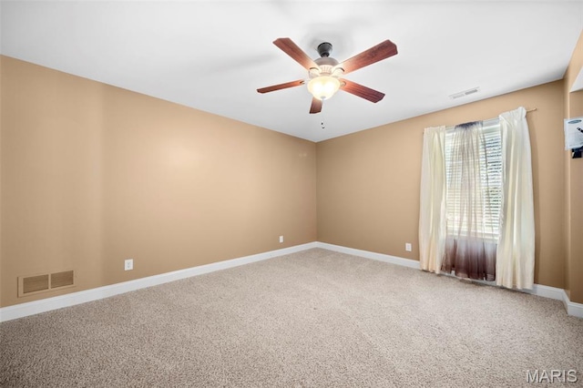 1019 Hawks Landing Dr, Lake St Louis, MO 63367 - carpeted spare room featuring a ceiling fan and baseboards