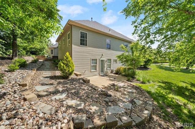 1019 Hawks Landing Dr, Lake St Louis, MO 63367 - back of house with a patio area and a lawn