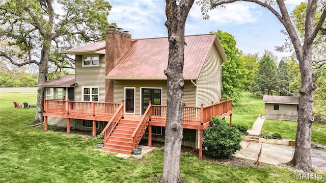 968 Super Slab Rd, Greenfield, IL 62044 - back of house with stairway, a wooden deck, a lawn, a chimney, and metal roof