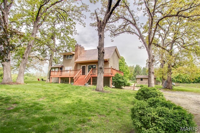 968 Super Slab Rd, Greenfield, IL 62044 - back of property with stairs, a deck, a lawn, and a chimney