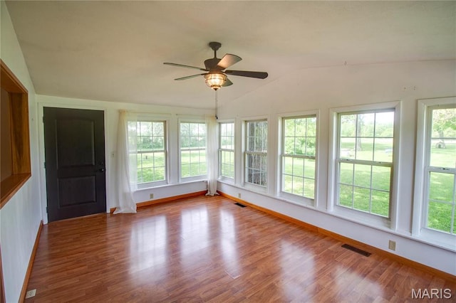968 Super Slab Rd, Greenfield, IL 62044 - unfurnished sunroom featuring healthy amount of natural light, vaulted ceiling, wood finished floors, and baseboards