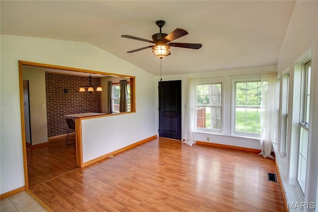 968 Super Slab Rd, Greenfield, IL 62044 - empty room featuring baseboards, vaulted ceiling, healthy amount of natural light, wood finished floors, and a ceiling fan