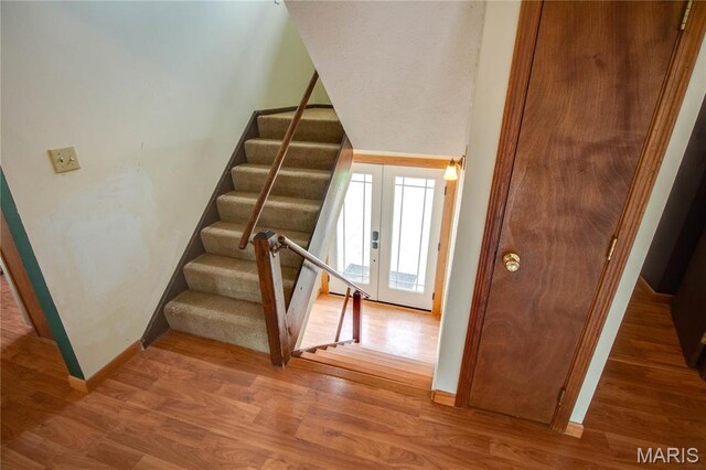 968 Super Slab Rd, Greenfield, IL 62044 - stairs with baseboards, wood finished floors, and french doors