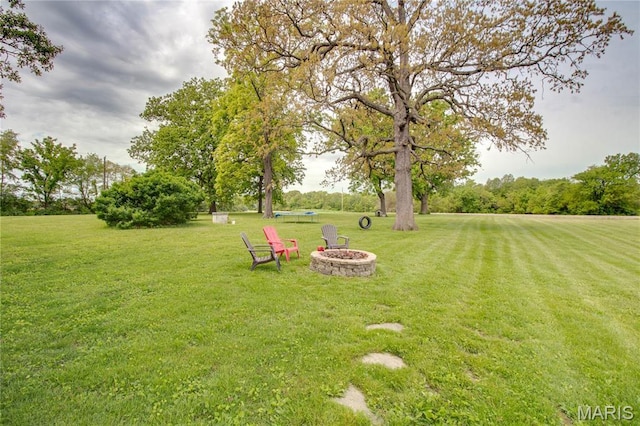 968 Super Slab Rd, Greenfield, IL 62044 - view of grassy yard with an outdoor fire pit