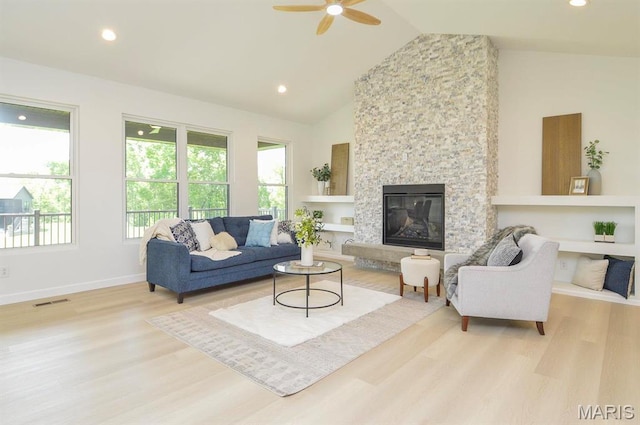 1391 Walnut Ridge Dr, Columbia, IL 62236 - living room featuring wood finished floors, ceiling fan, baseboards, high vaulted ceiling, and a fireplace