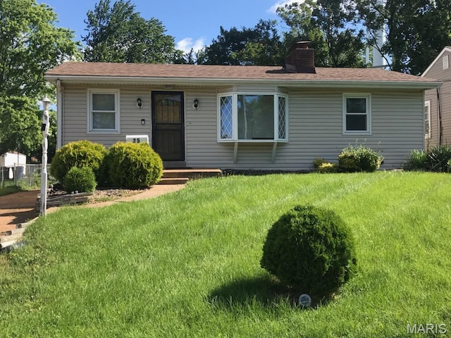 25 Reasor Dr, Saint Louis, MO 63135 - view of front of house featuring a front yard and a chimney
