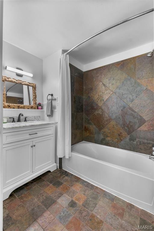 1353 Karen Dr, Cape Girardeau, MO 63701 - full bathroom featuring stone finish floors, shower / bath combo with shower curtain, and vanity