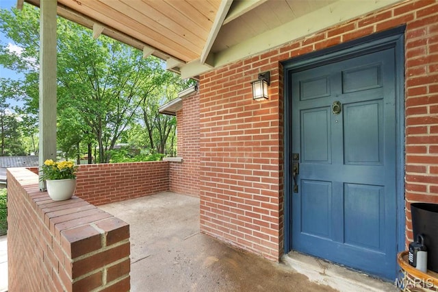 1353 Karen Dr, Cape Girardeau, MO 63701 - view of exterior entry featuring brick siding and covered porch