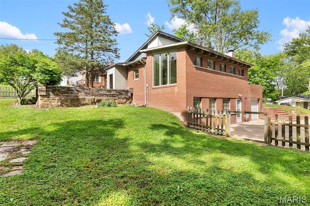 1353 Karen Dr, Cape Girardeau, MO 63701 - view of home's exterior with a chimney and brick siding