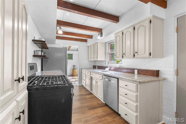 1353 Karen Dr, Cape Girardeau, MO 63701 - kitchen with stainless steel appliances, a sink, wood finished floors, beam ceiling, and open shelves