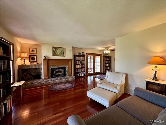 15716 County Road 5190, Rolla, MO 65401 - living room featuring a fireplace, wood finished floors, and baseboards