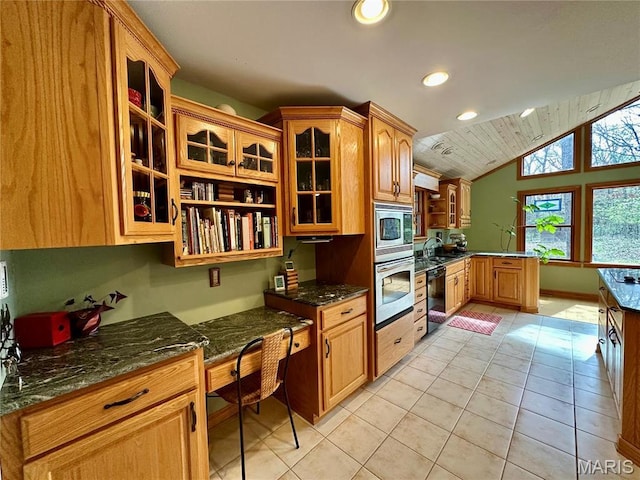 15716 County Road 5190, Rolla, MO 65401 - kitchen featuring stainless steel appliances, a peninsula, glass insert cabinets, recessed lighting, and vaulted ceiling