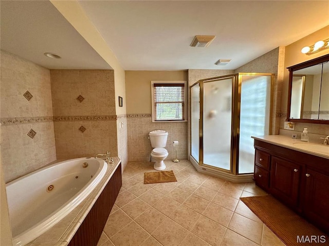 15716 County Road 5190, Rolla, MO 65401 - full bath with tile patterned flooring, tile walls, a shower stall, toilet, and vanity