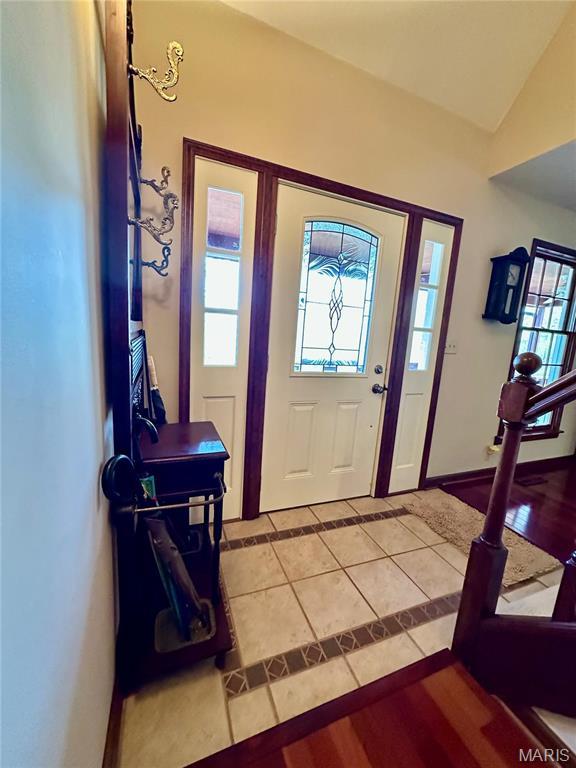 15716 County Road 5190, Rolla, MO 65401 - foyer with light tile patterned floors, baseboards, and vaulted ceiling