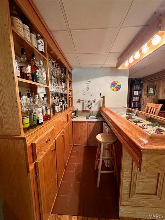 15716 County Road 5190, Rolla, MO 65401 - indoor dry bar featuring a paneled ceiling and dark tile patterned floors