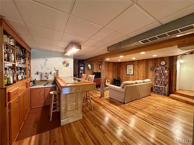 15716 County Road 5190, Rolla, MO 65401 - indoor bar featuring a paneled ceiling, light wood-type flooring, and wood walls