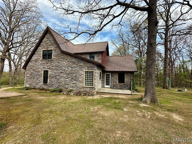 15716 County Road 5190, Rolla, MO 65401 - rear view of property with stone siding, metal roof, and a lawn