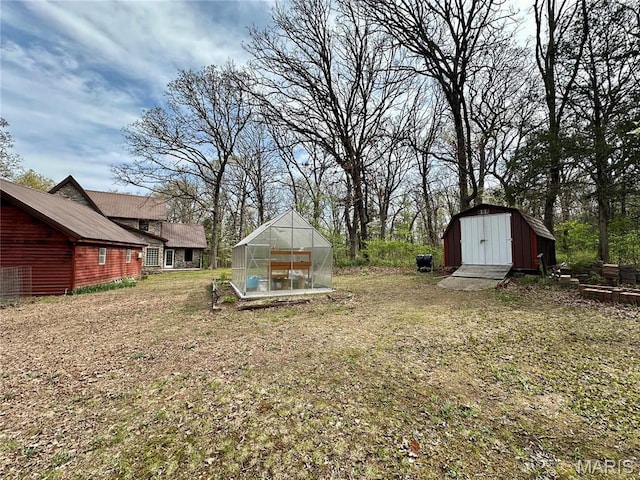 15716 County Road 5190, Rolla, MO 65401 - view of grassy yard with an exterior structure, an outbuilding, and a storage unit