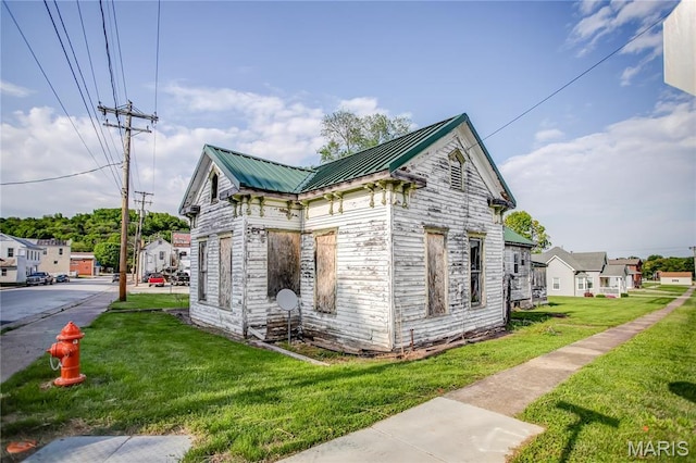 212 Franklin St, Hardin, IL 62047 - view of side of property featuring a lawn and metal roof