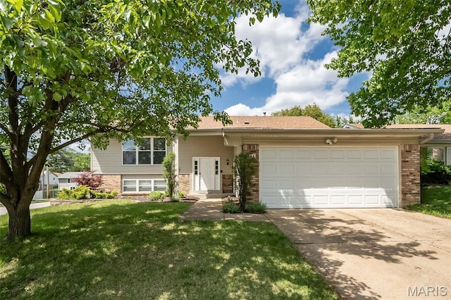 101 Holly Green Dr, Ballwin, MO 63021 - view of front of home with brick siding, a garage, driveway, and a front lawn