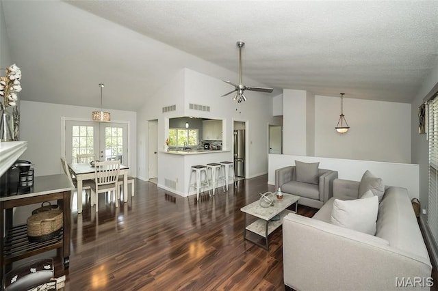 101 Holly Green Dr, Ballwin, MO 63021 - living room featuring french doors, a ceiling fan, dark wood finished floors, high vaulted ceiling, and a textured ceiling