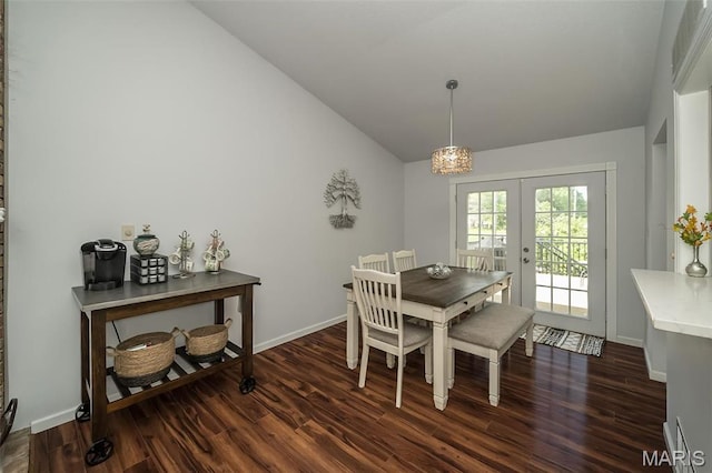 101 Holly Green Dr, Ballwin, MO 63021 - dining space featuring vaulted ceiling, french doors, dark wood-style floors, and baseboards