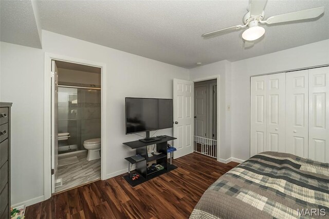 101 Holly Green Dr, Ballwin, MO 63021 - bedroom featuring baseboards, dark wood finished floors, a closet, a textured ceiling, and a ceiling fan