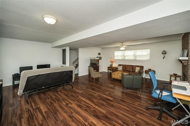 101 Holly Green Dr, Ballwin, MO 63021 - bedroom with wood finished floors, a textured ceiling, baseboards, and an office area