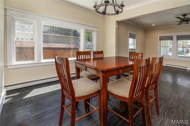 305 W Ray St, Christopher, IL 62822 - dining space featuring a chandelier, a baseboard heating unit, dark wood-style flooring, crown molding, and a baseboard radiator