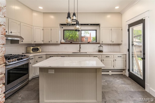305 W Ray St, Christopher, IL 62822 - kitchen featuring stainless steel gas range, under cabinet range hood, a sink, white microwave, and marble tiled flooring