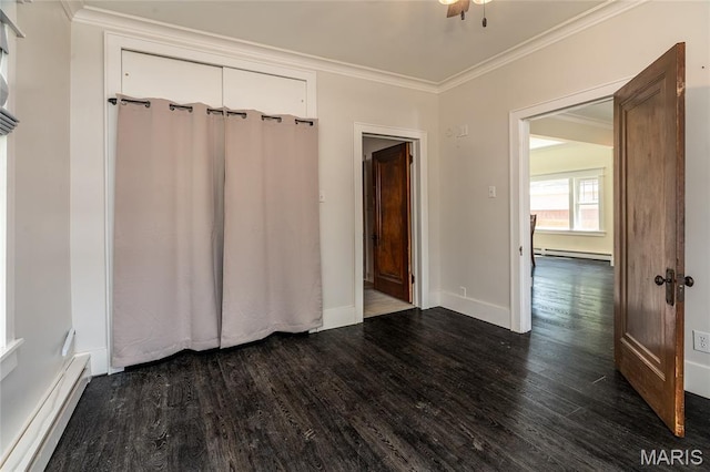 305 W Ray St, Christopher, IL 62822 - unfurnished room with a baseboard radiator, dark wood-style floors, crown molding, and baseboards