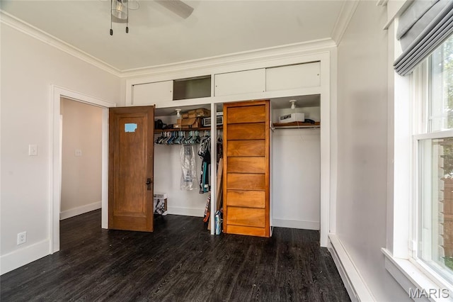 305 W Ray St, Christopher, IL 62822 - unfurnished bedroom featuring crown molding, wood finished floors, multiple closets, and baseboards